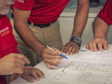 Employees working around a table together