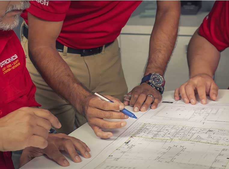 Employees working around a table together